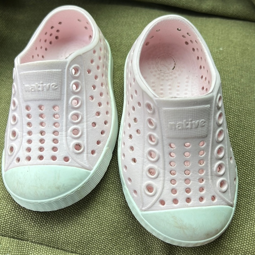 Pale pink and white native shoes.
